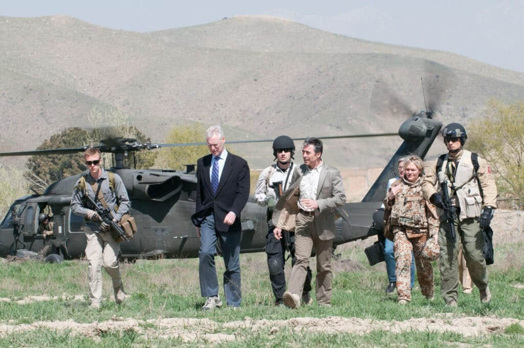 NATO Secretary General Anders Fogh Rasmussen and NATO Senior Civilian Representative Ambassador Simon Gass arrive at Camp Moorhead, Afghanistan, April 12. 2012. Photo: by Maitre Christian Valverde, French Navy, ISAF Public Affairs Office. (CC BY-NC-ND 2.0).