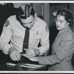 Rosa_Parks_being_fingerprinted_by_Deputy_Sheriff_D.H._Lackey_after_being_arrested_for_refusing_to_give_up_her_seat_for_a_white_passenger_on_a_segregated_municipal_bus_in_Montgomery,_Alabama_-_Original