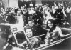 President John F. Kennedy motorcade, Dallas, Texas, Friday, November 22, 1963. Also in the presidential limousine are Jackie Kennedy, Texas Governor John Connally and his wife, Nellie. Photo: Victor Hugo King, who placed the photograph in the public domain (presumably when he gave it to the Library of Congress).