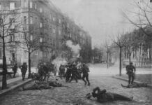 Den tyske revolution i 1919 var med til at forme den unge Poul Mittick, Der tidligt blev medlem af Spartacists' Freie Sozialistische Jugend og senere rådskommunist. Gadekampe mellem regeringstropper og revolutionære militser i Berlin i september 1919.. Foto af Keystone/Getty Images. Public Domain.