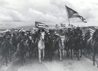 Raúl Corrales Forno famous image of the victorious 1959 Cuban Revolution entitled "La Caballería" (The Cavalry). The image shows a group of Fidel Castro's July 26 Movement rebels mounted on horses and brandishing Cuban flags whipped by the wind. January 1959. Source: Museo de la Revolución, en La Habana, Cuba. Photo: Raúl Corrales Forno. Public Domain.