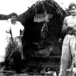 Ernesto Guevara (right) with Alberto Granado (left) aboard their “Mambo-Tango” raft on the Amazon River in June of 1952. Photo: Unknown. Public Domain. Collection: Museo Che Guevara (Centro de Estudios Che Guevara en La Habana, Cuba).