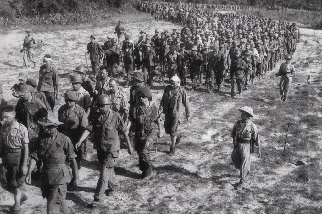 Captured French soldiers, escorted by Vietnamese troops, walk to a prisoner-of-war camp in Dien Bien Phu. Source http://www.ibtimes.co.uk/vietnam-celebrates-60th-anniversary-battle-dien-bien-phu-victory-1447556 PHoto: Stringer, AFP. Public Domain.