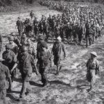 Captured French soldiers, escorted by Vietnamese troops, walk to a prisoner-of-war camp in Dien Bien Phu. Source 	http://www.ibtimes.co.uk/vietnam-celebrates-60th-anniversary-battle-dien-bien-phu-victory-1447556 PHoto: Stringer, AFP. Public Domain.
