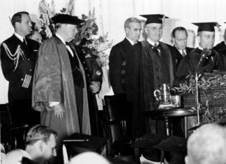 Winston Churchill "Iron Curtain" speech at Westminster College (MSA). President Harry Truman stands at podium before former British Prime Minister Winston Churchill delivers his "Sinews of War" speech in Fulton, Missouri. Collection Name: Gerald R. Massie Photograph Collection. Courtesy of Missouri State Archives. Photo taken March 5, 1946. Public Domain.