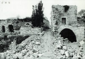PHOTO: Ruins of homes left empty from the Deir Yassin Massacre, 1986. (Source: deiryassinremembered.org)