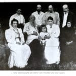 Leo Tolstoy and members of his family in 1908: Seated, left to right: Lisa Obolenski (Marya Tolstoy’s daughter), Tatyana (Tolstoy’s daughter), Leo Tolstoy, Tanya (Mikhail Tolstoy’s daughter), Sofia (Tolstoy’s wife), Marya (Tolstoy’s sister), Vanya (Mikhail Tolstoy’s son). Standing: Alexandra (Tolstoy’s daughter), Mikhail (Tolstoy’s son), Mikhail Sukhotin (Tatyana Tolstoy’s husband), Andrei (Tolstoy’s son). From: Tatyana Tolstoy: Tolstoy remembered, Michael Joseph London 1977, ISBN 0 7181 1626 7. Photo: Unknown author. Public Domain.