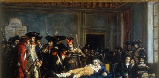 "Morning of 10 thermidor An II" Lying on a table, wounded, in a room of the Convention, Robespierre is the object of the curiosity and quips of Thermidorians, Oil on canvas painted ca. 1877 by Lucien-Étienne Mélingue (1841–1889), French artist and painter. Collection: Musée de la Révolution française. (CC BY-SA 2.0 FR).