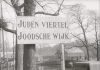 Jewish Ghetto in Amsterdam, Nederlands. WS street with large street sign: JUDEN VIERTEL JOODSCHE WIJK. 1942. See about the Dutch protests against persecutions of jews, January 25. 1941. Accessed at US Holocaust Memorial Museum, courtesy of Nederlands Instituut voor Beeld en Geluid.