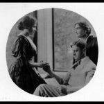 John Macy reads to Helen Keller while Anne Sullivan-Macy watches, ca. 1914. Photo: Whitman Studio, Chelsea, Mass., United States, 1900-1919