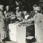 Charlotte Despard and Emmeline Pethick Lawrence buying vegetables from a produce stall; manuscript inscriptions on reverse ‘Mrs Pethick Lawrence & Mrs Despard (1930s). Photo: The Women’s Library collection/Library of the London School of Economics and Political Science. No known copyright restrictions.