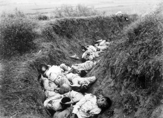 Filipino casualties on the first day of Philippine-American War. Original caption is 'Insurgent dead just as they fell in the trench near Santa Ana, February 5th. The trench was circular, and the picture shows but a small portion.' Date: 5 February 1899. This image is a work of a U.S. Army soldier or employee, taken or made as part of that person's official duties. As a work of the U.S. federal government, the image is in the public domain.