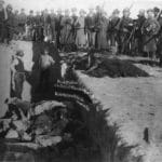 Burial of the dead after the massacre of Wounded Knee. U.S. Soldiers putting Indians in common grave; some corpses are frozen in different positions. South Dakota, 1891. Photo: Library of Congress Prints and Photographs Division, Public Domain.
