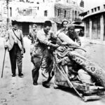 Arabs driven out of Haifa by jewish soldiers in the city. 21-22. April 1948. Photo: unknown. Public Domain.