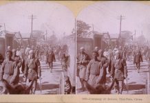 Company of Boxers, Tien-Tsin, China (photograph: The Whiting View Company, 1901). The Opium Wars and Boxer Rebellion were violent products of nineteenth-century contact between China and the West. Although British operations in China during the period are well documented, few photographs of the Chinese Boxer troops survive. Originating in the mid-nineteenth century, the stereograph was an ancestor of the newsreel, affording Americans a window on the remote corners of the globe. 1901. Source: Library of Congress. Author: Museum of Photographic Arts Collections. Publiuc Domain.