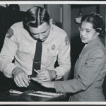 Rosa Parks being fingerprinted on February 22, 1956, by Deputy Sheriff D.H. Lackey as one of the people indicted as leaders of the Montgomery bus boycott. She was one of 73 people rounded up by deputies that day after a grand jury charged 113 African Americans for organizing the boycott. This was a few months after her arrest on December 1, 1955, for refusing to give up her seat to a white passenger on a segregated municipal bus in Montgomery, Alabama. Photo: Associated Press. Public domain.