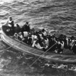 Titanic. Last lifeboat arrived, filled with Titanic survivors. This photograph was taken by a passenger of the Carpathia, the ship that received the Titanic’s distress signal and came to rescue the survivors. It shows the last lifeboat successfully launched from the Titanic. Date: 15 April 1912 (original photo taken). Photo: passenger on the Carpathia. Public Domain.