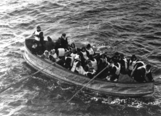 Titanic. Last lifeboat arrived, filled with Titanic survivors. This photograph was taken by a passenger of the Carpathia, the ship that received the Titanic's distress signal and came to rescue the survivors. It shows the last lifeboat successfully launched from the Titanic. Date: 15 April 1912 (original photo taken). Photo: passenger on the Carpathia. Public Domain.