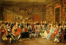 Reading of Voltaire's L'Orphelin de la Chine (a tragedy about Ghengis Khan and his sons, published in 1755), in the salon of Madame Geoffrin (Malmaison, 1812). The picture shows a gathering of distinguished guests in the drawing-room of French hostess Marie-Thérèse Rodet Geoffrin (1699-1777) who is seated on the right. Artistic license has been taken, both in terms of the number of attendees, and who could have attended in 1755. At least one is depicted much younger than he would have been in 1755, had he lived that long. Among the many litterary guests are Jean-Jacques Rousseau and Voltaire, the last though in form of a bust. Oil on canvas painted by Anicet Charles Gabriel Lemonnier (1743–1824), French painter. Collection: Château de Malmaison. Public Domain.
