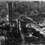 Warsaw Ghetto, smashed into the ground by German destroying forces (de.: Vernichtungskommando), according to Adolf Hitler`s order, after supressing of the Warsaw Ghetto Uprising in 1943. North view from Courthouse at Leszno street, in the foreground is seen the ruins of houses: Leszno 52 and 50, photo taken in 1945. Photo: Unknown. Public Domain.