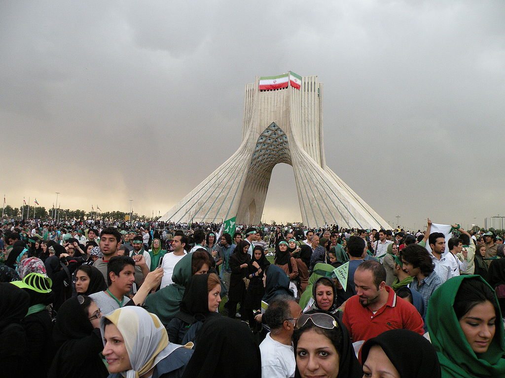 Thousands of supporters of presidential candidate of Iran, Mir Hossein Musavi gathered together in Tehran,Azadi square showing their support. Source: دوربین شخصی Author: ? Public domain. Source: Wikimedia Commons