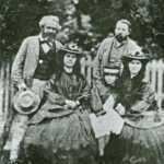 Friedrich Engels, Karl Marx and Marx’s daughters: Jenny Caroline (1844–1883), Jenny Julia Eleanor (1855–1898), and Jenny Laura (1845–1911). Date: 1860s (1864?). Photo: Unknown. Public Domain.