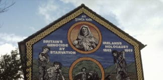 Ireland's Holocaust mural on the Ballymurphy Road or Whiterock road?, Belfast. "An Gorta Mór, Britain's genocide by starvation, Ireland's holocaust 1845–1849, over 1,500,000 deaths". Photo: Miossec. (CC BY-SA 3.0).