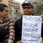 A Swede who joined the 2011 Egyptian protests in Tahrir Square. The text reads: “Swedish bullets kill democracy (stop arms hypocrisy!)”, in reference to the use by Egyptian riot police and security forces of ammunition made in Sweden. Photo: Taken 6 February 2011 by Sherif9282. (CC BY-SA 3.0).