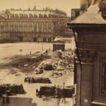 On May 16, 1871, a group of Communards pulled down the Vendôme Column. In Franck’s photograph its shattered remains litter the Place Vendôme. Modeled on the ancient Column of Trajan in Rome, the Vendôme Column was built by Napoleon I in the first decade of the nineteenth century as a glorification of the victorious French soldiers who defeated the Russian-Austrian alliance at the Battle of Austerlitz; the seventy-six battle-scene bas-reliefs that spiral up the shaft were cast from the bronze of 250 captured Russian cannons. Louis-Philippe crowned the column with a statue of Napoleon in 1833, and Napoleon III replaced it thirty years later with another of Napoleon in Roman costume. Photo: Albumen silver print from glass negative by  François-Marie-Louis-Alexandre Gobinet de Villecholle Franck (1816–1906), French photographer. Collection: Metropolitan Museum of Art, New York. Public Domain.