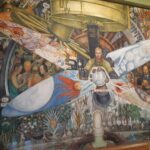 “El hombre controlador del universo” , or also known as “El hombre en el cruce de caminos” a fresco painting with dimensions of 4.80 × 11.45 m, made by Diego Rivera. This painting is located in the Palacio de Bellas Artes, in CDMX. Photo: Taken 6 July 2019 by Renata Frias. (CC BY-SA 4.0).