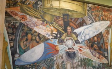 "El hombre controlador del universo" , or also known as "El hombre en el cruce de caminos" a fresco painting with dimensions of 4.80 × 11.45 m, made by Diego Rivera. This painting is located in the Palacio de Bellas Artes, in CDMX. Photo: Taken 6 July 2019 by Renata Frias. (CC BY-SA 4.0).