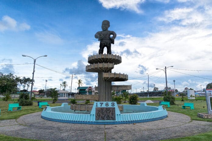 The 1763 Monument on Square of the Revolution in Georgetown, Guyana (also known as the Cuffy Monument) commemorates the Berbice Slave Rebellion of 1763. The monument was designed by Philip More. Photo taken on November 21, 2019 by Dan Lundberg. (CC BY-SA 2.0).