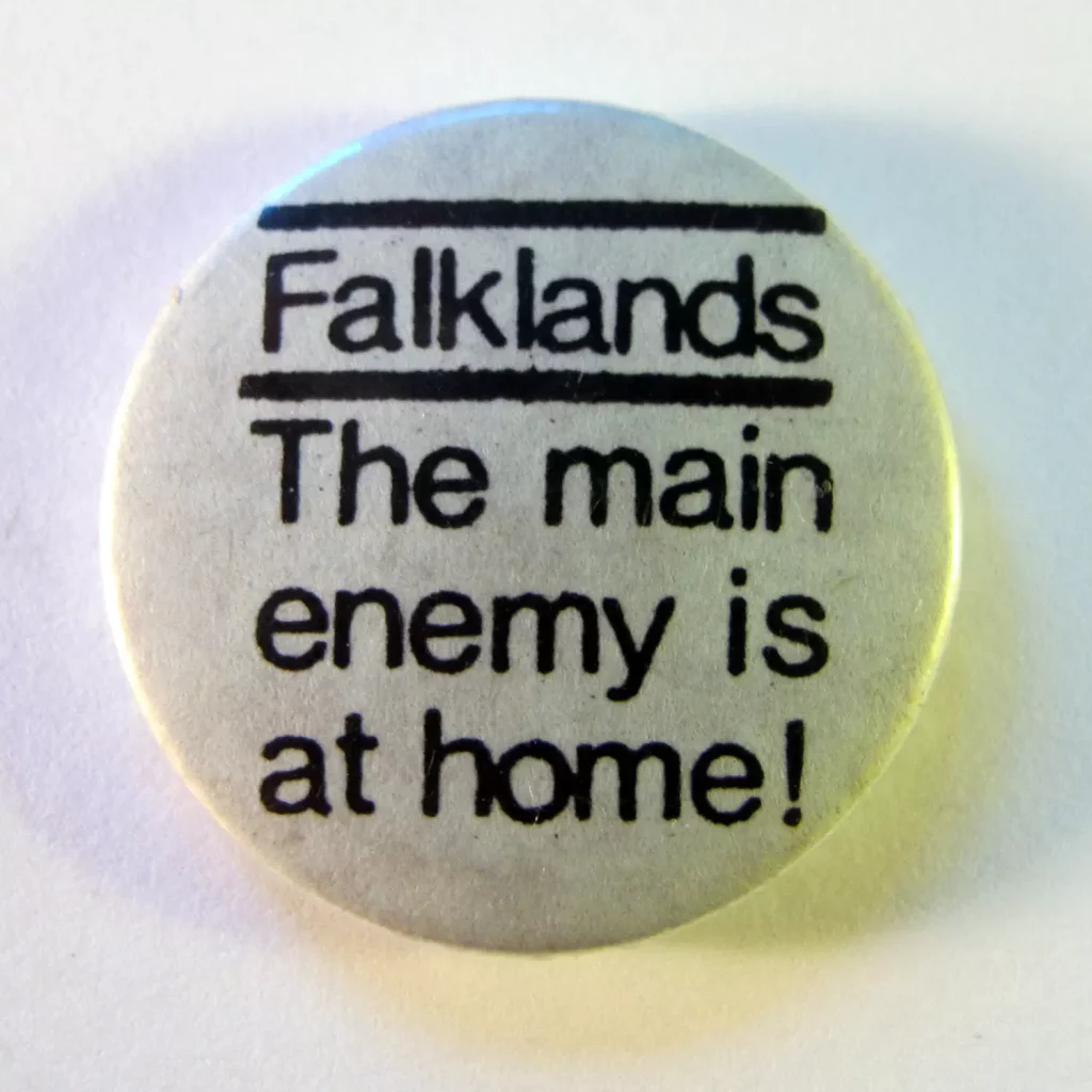 Falklands: The Main Enemy is at Home. The Falklands War began with the Argentinean invasion of Falkland Islands in April 1982, and ended with their recapture two and a half months later by British forces.'The main enemy is at home' is an anti-imperialist slogan of Karl Liebknecht, the German socialist revolutionary. The implication is that opposition to one's own ruling class is more important than loyalty to the state during wartime. Photo: Danny Birchall. (CC BY 2.0).