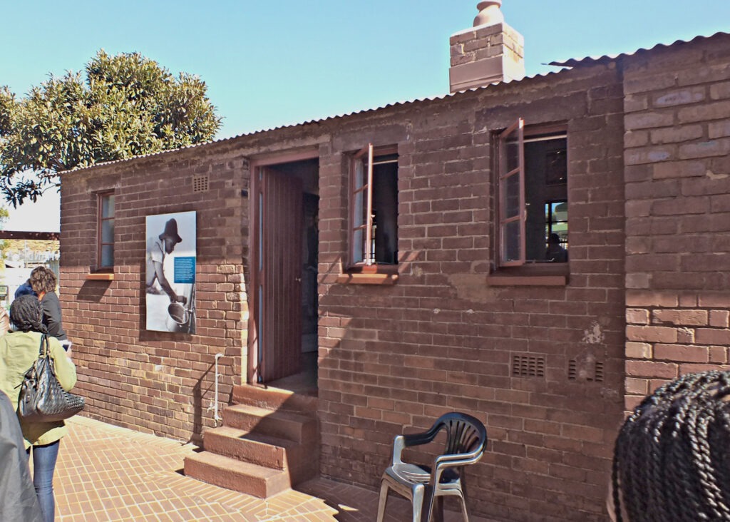 The Mandela House, located in the township of Soweto in Johannesburg, South Africa, is the former home of former South African president and his wife, Nelson Mandela and Winnie Mandela. This was the home for Nelson Mandela before his 27-year imprisonment, and his home immediately after being released from prison. The home is now a museum. Photo: Taken 14 July 2013 by A. Bailey. (CC BY-SA 3.0).
