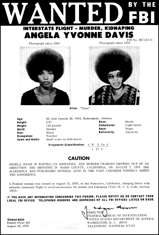 Angela Davis wanted by the FBI on a Federal warrant issued August 15, 1970 for kidnaping and murder charges. On August 18, 1970, FBI director J. Edgar Hoover listed Angela Davis on the FBI's Ten Most Wanted Fugitive List. Photo: Federal Bureau of Investigation, United States Government. Public Domain.