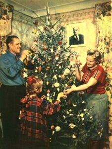 Family of a metallurgist G.M. Sleptsov decorates the Christmas tree. 1954. Photo: V. Shakhovsky.
