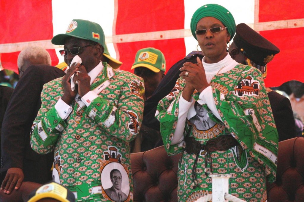 Zimbabwe President Robert Mugabe (L) and his wife Grace at a rally at Chubuku stadium in Chitungwiza town about 35km south of Harare, July 16, 2013. Zimbabwe goes to the polls on July 31. (CC BY-SA 3.0)