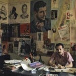 Ghassan Kanafani in the office in Beiruth. Right above the head of Ghassan Khanafani there is a poster from the Danish organisation KUF, made by Madsen – the poster can be seen in bottom of the section “PFLP-dokumenter på dansk” – PFLP-documents in Danish. Photo: Taken circa 1970 by Bruno Barbey (1941–2020), Moroccan-born French photographer. (CC0 1.0).